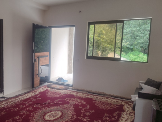اتاق پذیرایی ویلای دوخوابه با منظره جنگل